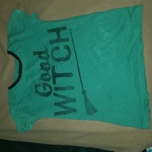 green t-shirt with black writing and colar.